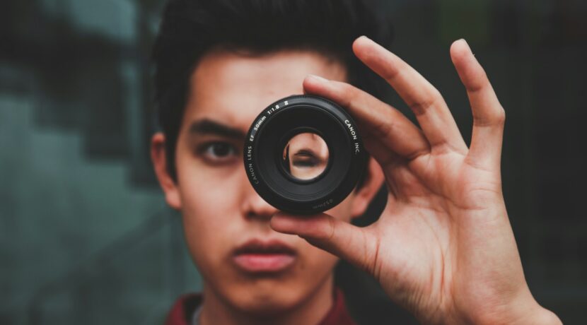 selective focus photography of man wearing red top
