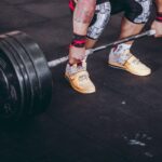 person holding the barbell