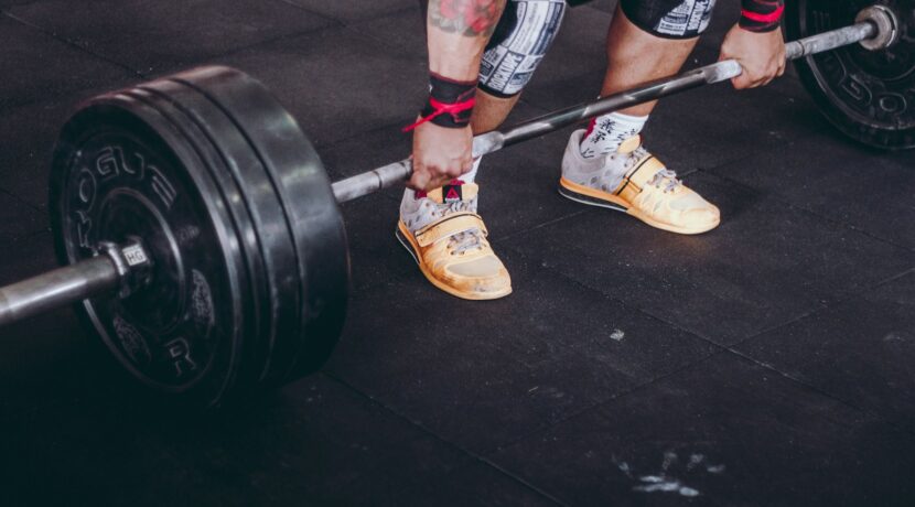person holding the barbell