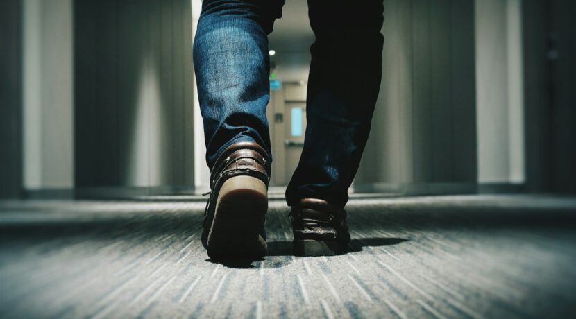 person walking on room