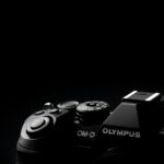 a close up of a camera on a black background