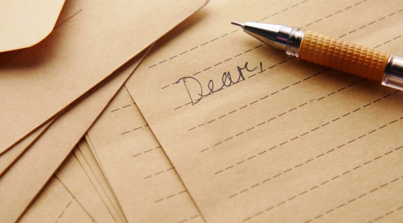 a pen sitting on top of a piece of paper