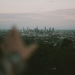 a person is taking a picture of a city