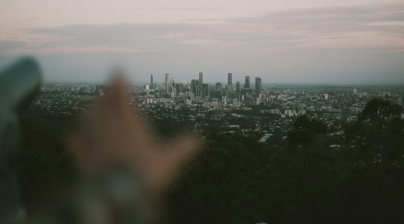 a person is taking a picture of a city