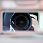 shallow focus photography of camera len
